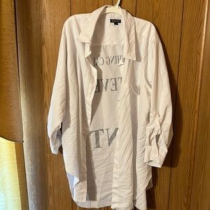 It’s a white shirt with black letters on the back.